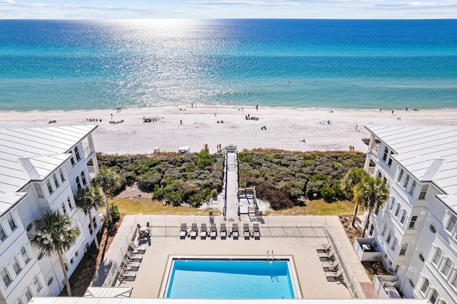 drone / aerial view featuring a view of the beach and a water view