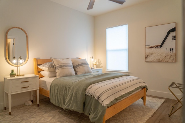 bedroom with hardwood / wood-style flooring and ceiling fan