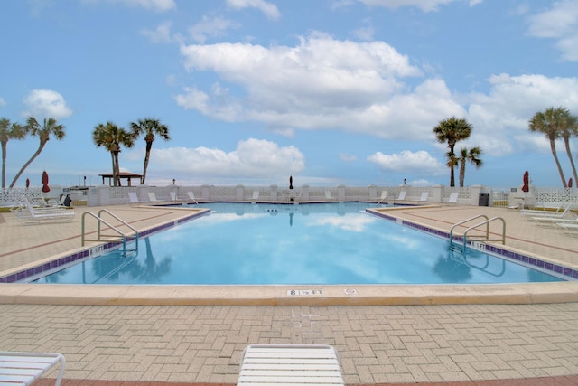 view of pool featuring a patio