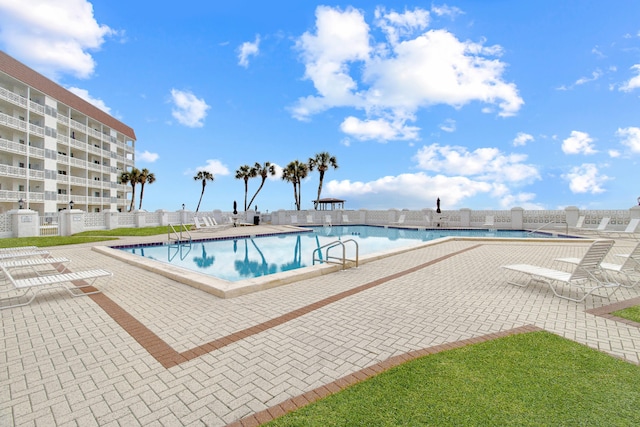 view of swimming pool with a patio area