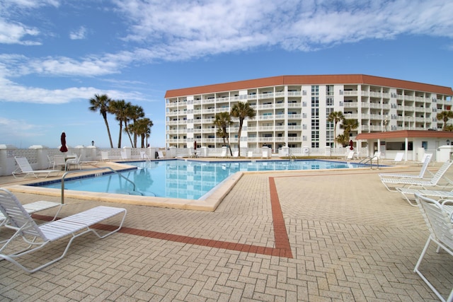 view of swimming pool with a patio area