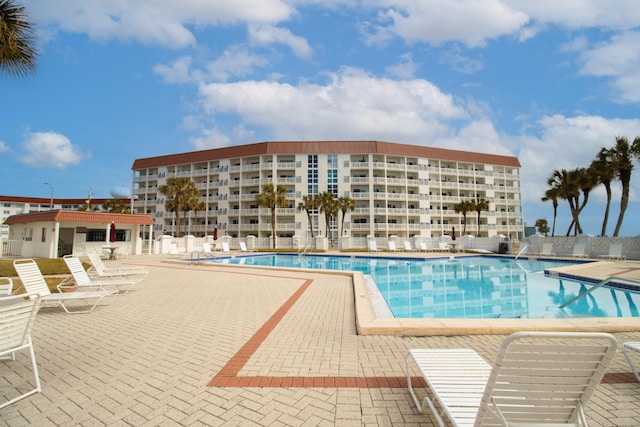 view of swimming pool with a patio