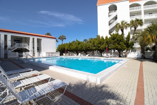 view of swimming pool with a patio area