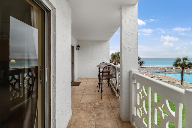 balcony featuring a water view