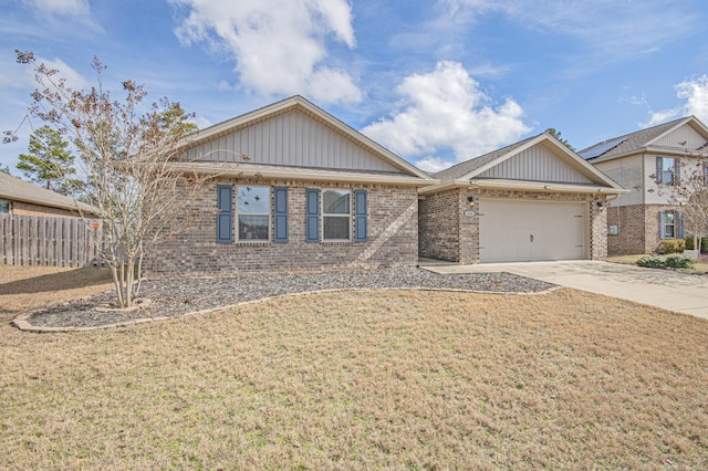 view of front of house featuring a garage and a front lawn