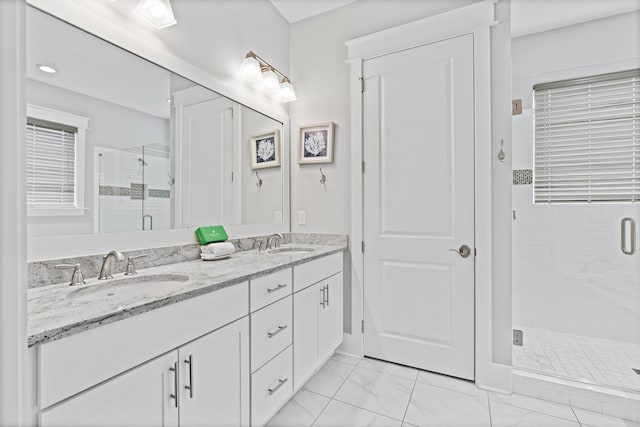 bathroom with walk in shower and vanity