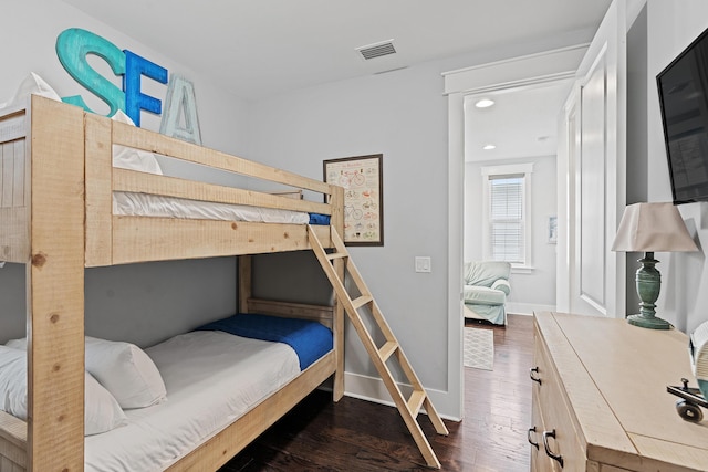 bedroom featuring dark wood-type flooring