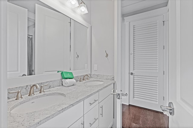 bathroom featuring vanity and hardwood / wood-style floors