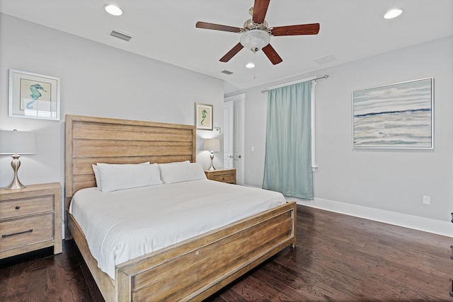 bedroom with dark hardwood / wood-style floors and ceiling fan