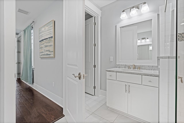 bathroom featuring vanity and tile patterned flooring