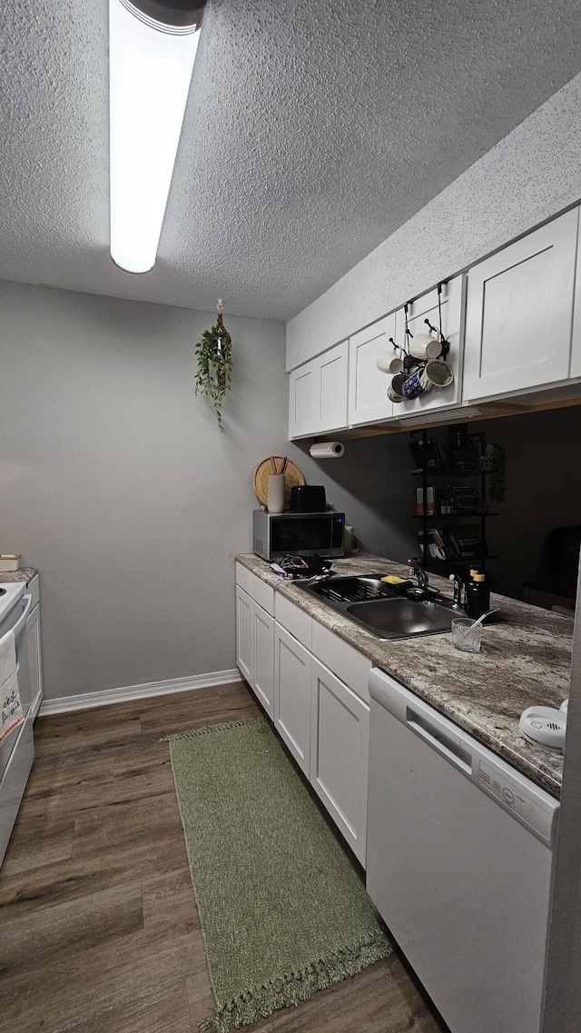 kitchen with white cabinetry, sink, white dishwasher, and dark wood-type flooring