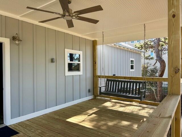 wooden deck with ceiling fan