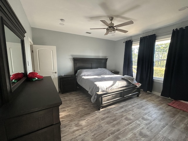 bedroom featuring ceiling fan and wood-type flooring