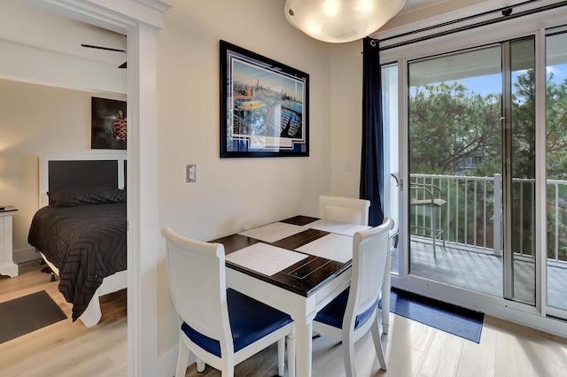 dining space with light hardwood / wood-style floors