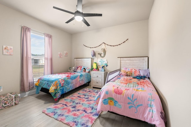 bedroom featuring ceiling fan and light wood-type flooring