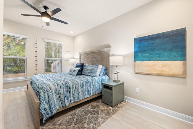 bedroom featuring hardwood / wood-style flooring and ceiling fan