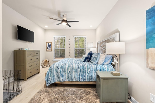 bedroom with ceiling fan and light wood-type flooring