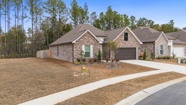 view of front of house with central AC and a garage