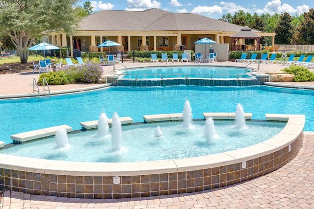 view of swimming pool featuring a gazebo and pool water feature