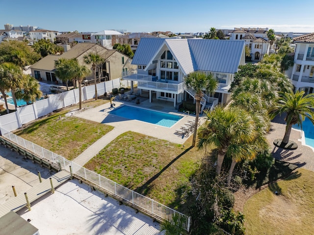 view of swimming pool with a yard and a patio area