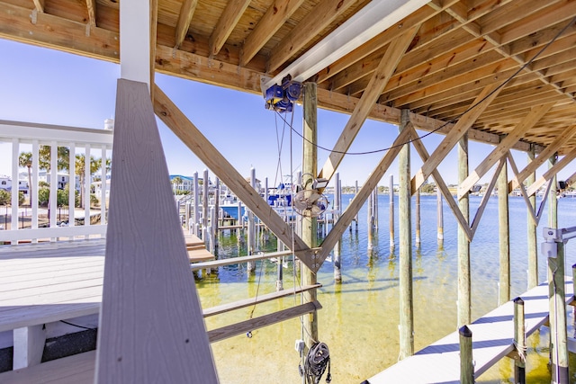 exterior space featuring a water view and a dock