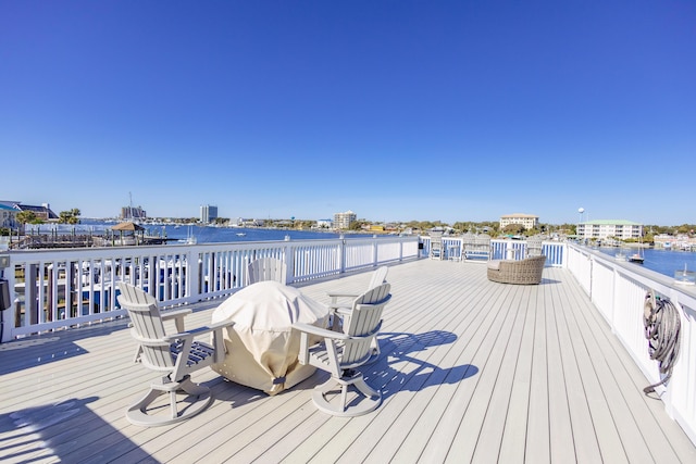 wooden deck featuring a water view