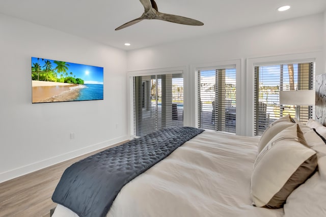 bedroom with hardwood / wood-style flooring, access to exterior, and ceiling fan