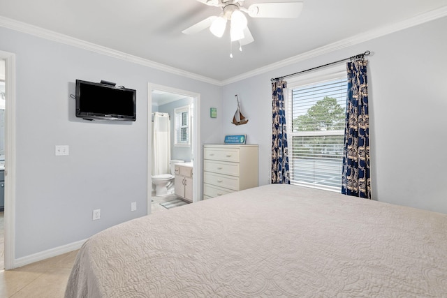 bedroom featuring crown molding, light tile patterned flooring, ceiling fan, and ensuite bath