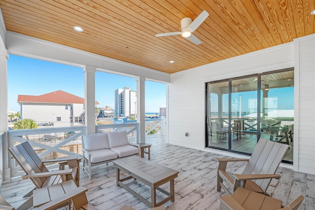 view of patio featuring an outdoor living space and ceiling fan