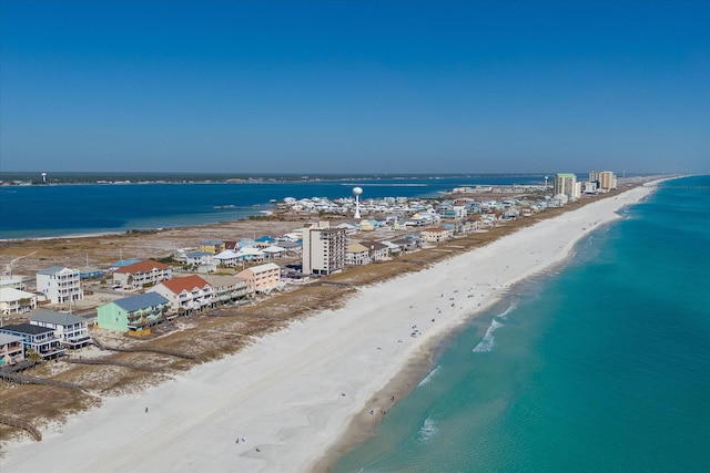 aerial view featuring a view of the beach and a water view