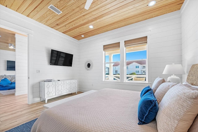 bedroom featuring wood ceiling and light hardwood / wood-style flooring