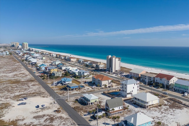 birds eye view of property with a view of the beach and a water view