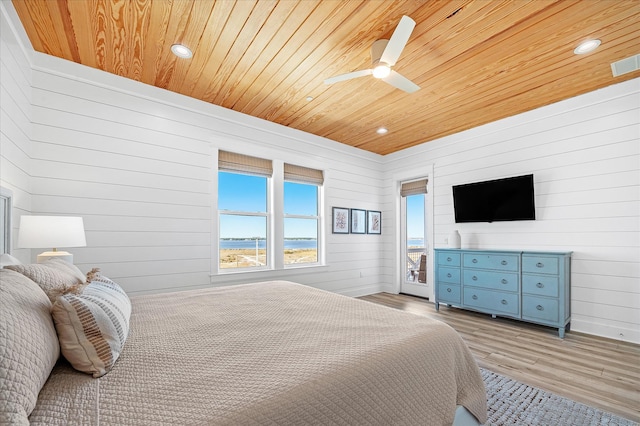 bedroom with ceiling fan, wood ceiling, and light hardwood / wood-style flooring