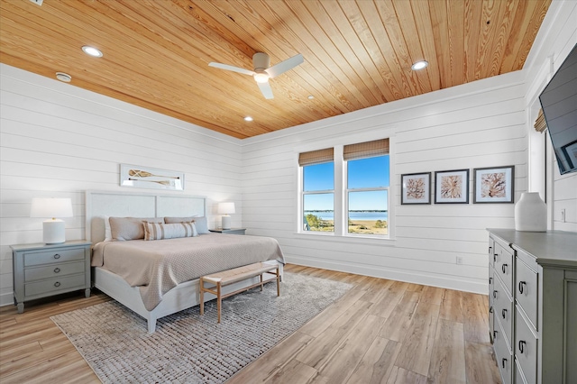 bedroom featuring wood ceiling, light hardwood / wood-style floors, and ceiling fan