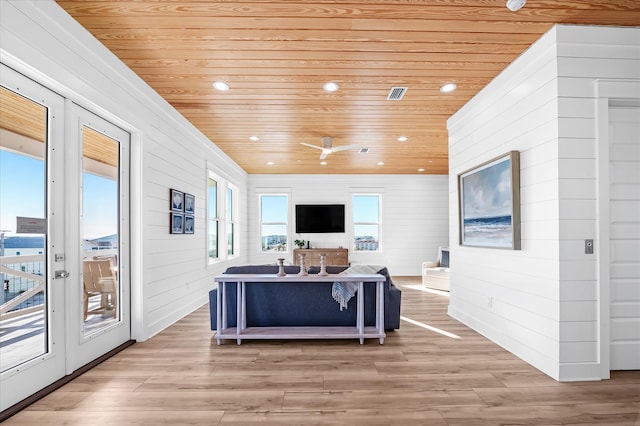 living room with light hardwood / wood-style flooring, wooden ceiling, and french doors