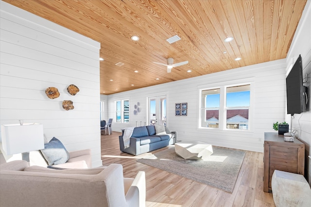 living room featuring wood ceiling and light hardwood / wood-style floors