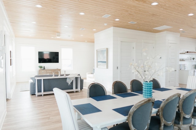 dining space with wood ceiling and light hardwood / wood-style floors