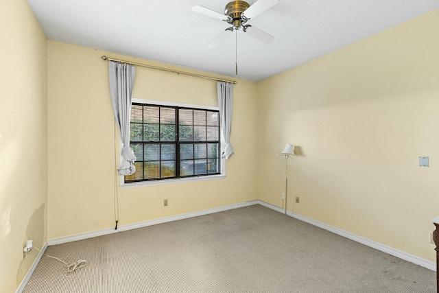 unfurnished room with ceiling fan and carpet floors