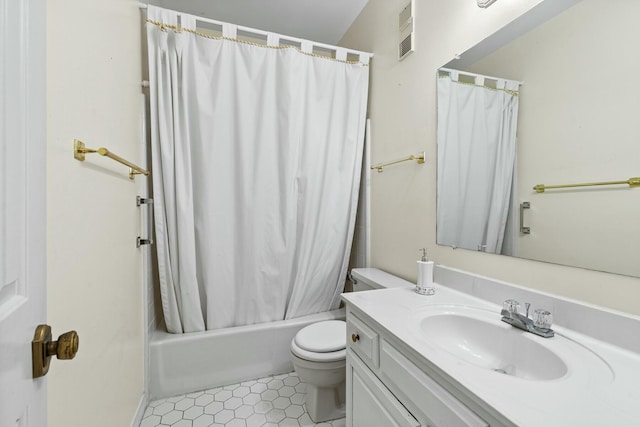 full bathroom with shower / bath combo, vanity, and toilet