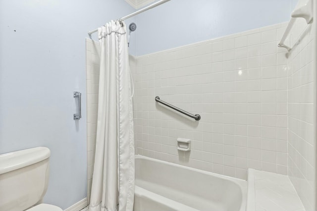 bathroom featuring shower / tub combo with curtain and toilet