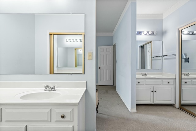 bathroom with ornamental molding and vanity