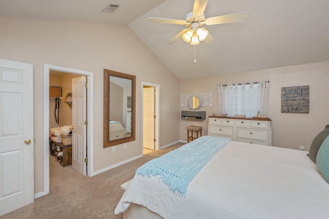 bedroom with vaulted ceiling, a spacious closet, light carpet, and ceiling fan