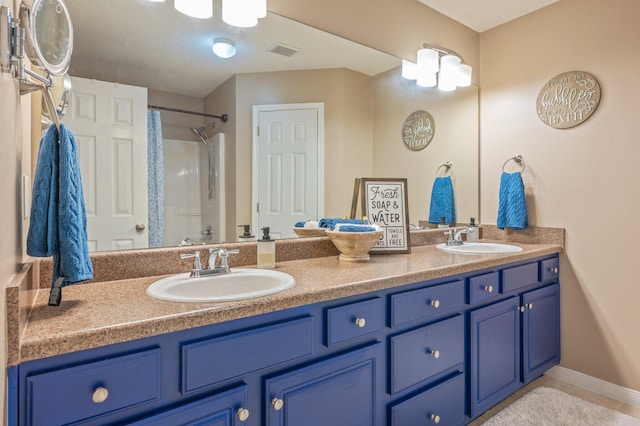 bathroom featuring vanity and walk in shower