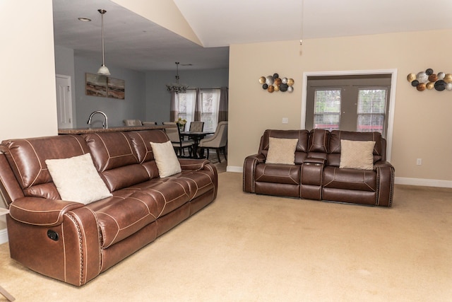 living room with lofted ceiling and carpet floors