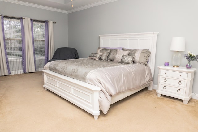 carpeted bedroom with crown molding