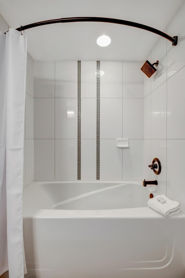 bathroom featuring shower / bathtub combination with curtain