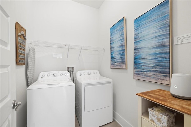 washroom with washer and clothes dryer