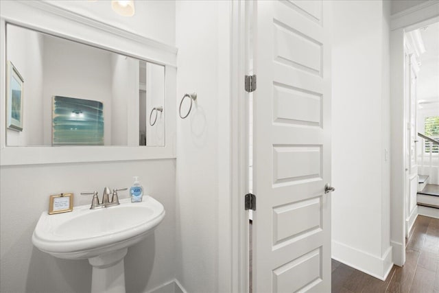 bathroom with sink and hardwood / wood-style floors