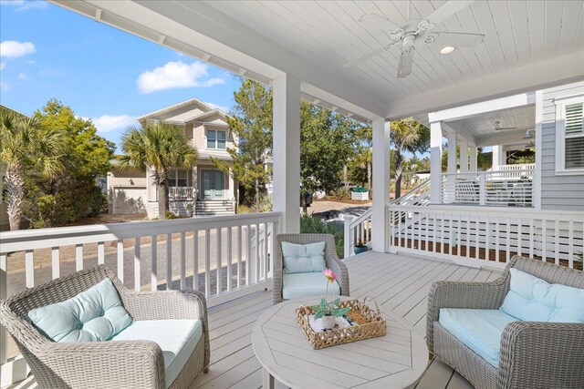 deck featuring outdoor lounge area and ceiling fan