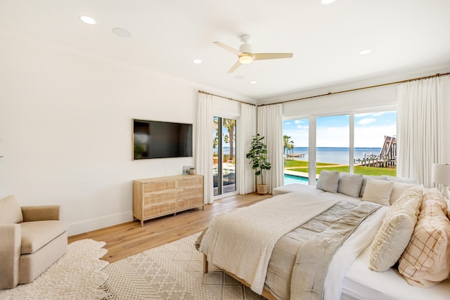 bedroom featuring ceiling fan, access to outside, and light hardwood / wood-style floors